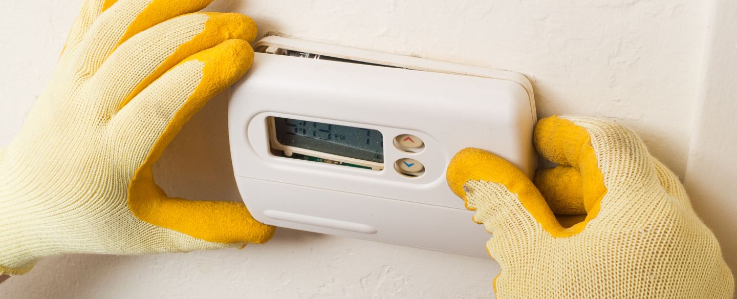 repairman conducting residential hvac repair tuscaloosa al